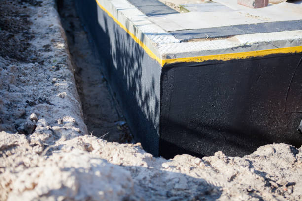 Professional Waterproofing technician working in Ada, MI
